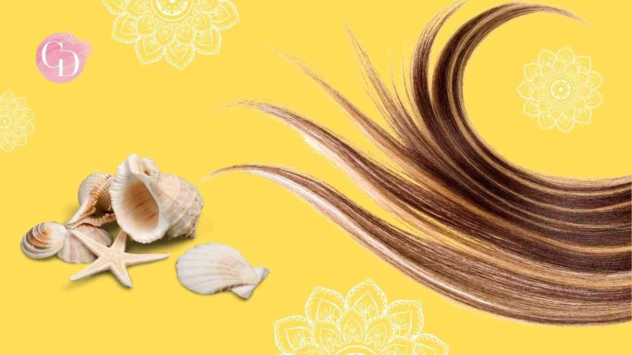 capelli su fondo giallo con conchiglie